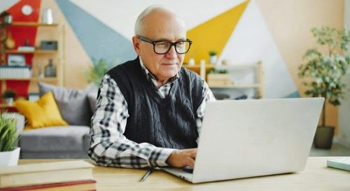 Senior man on laptop